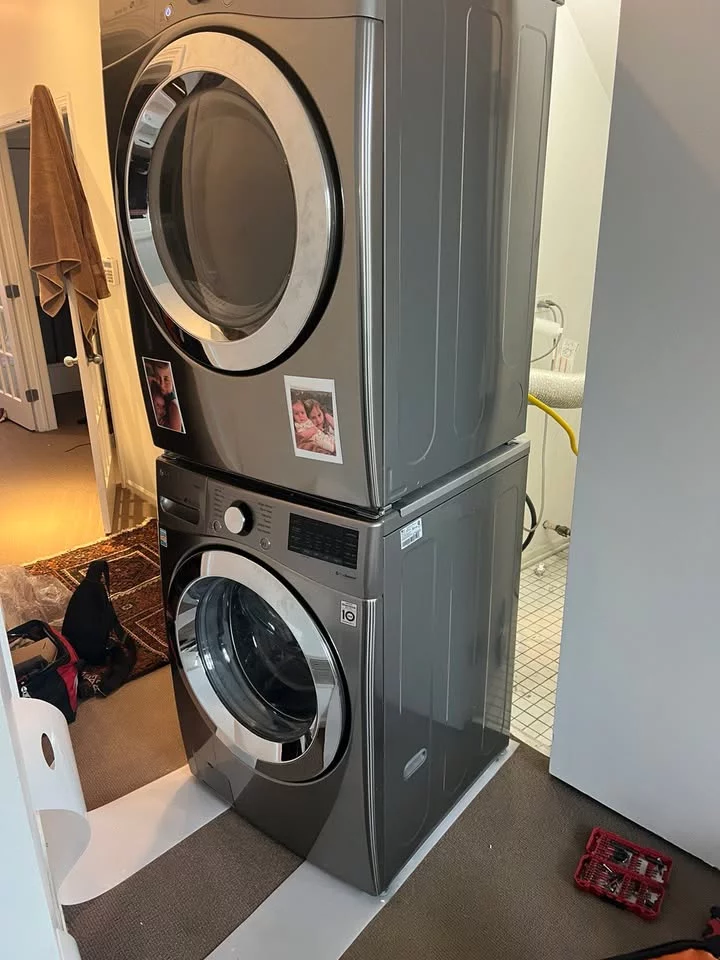 A laundry setup featuring modern washing machine and dryer, emphasizing functionality and design.